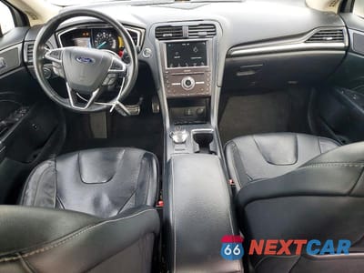 Zdjęcie 8 z 11 samochodu: 2017 FORD FUSION TITANIUM HEV VIN:3FA6P0RUXHR295850 - miniatura