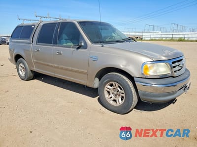 Czwarte zdjęcie samochodu z boku: 2001 FORD F-150 VIN:1FTRW07L81KA90283 - miniatura