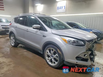 Czwarte zdjęcie samochodu z boku: 2014 FORD ESCAPE TITANIUM VIN:1FMCU0J90EUC91805 - miniatura