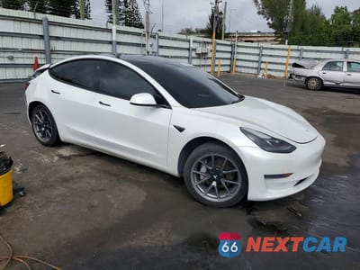 Czwarte zdjęcie samochodu z boku: 2021 TESLA MODEL 3 VIN:5YJ3E1EA3MF978506 - miniatura