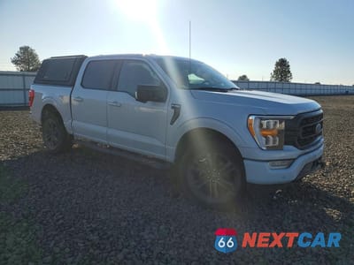 Czwarte zdjęcie samochodu z boku: 2021 FORD F150 SUPERCREW VIN:1FTFW1E82MKD01862 - miniatura