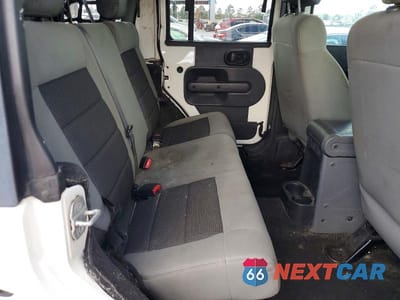 Zdjęcie 11 z 14 samochodu: 2009 JEEP WRANGLER UNLIMITED X VIN:1J4GA39139L770935 - miniatura