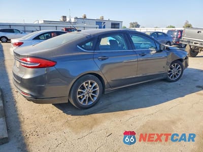 Trzecie zdjęcie samochodu z tyłu: 2017 FORD FUSION SE VIN:3FA6P0H72HR171986 - miniatura