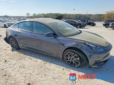 Czwarte zdjęcie samochodu z boku: 2023 TESLA MODEL 3 VIN:5YJ3E1EA4PF428283 - miniatura