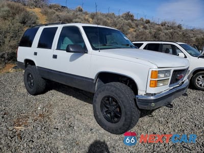 Czwarte zdjęcie samochodu z boku: 1999 GMC YUKON VIN:1GKEK13R2XJ756082 - miniatura