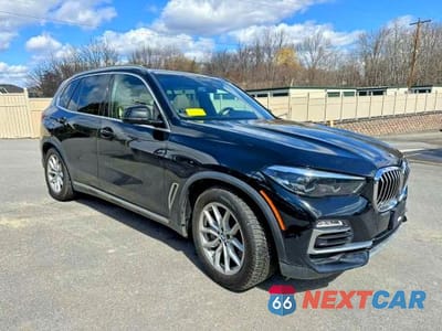 Czwarte zdjęcie samochodu z boku: 2021 BMW X5 XDRIVE45E VIN:5UXTA6C06M9F01809 - miniatura