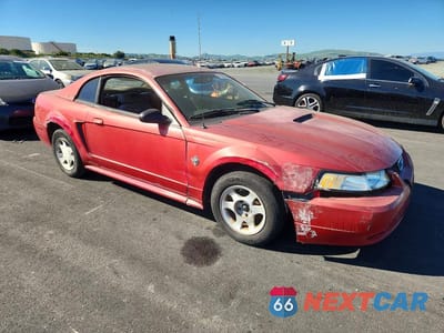 Czwarte zdjęcie samochodu z boku: 1999 FORD MUSTANG VIN:1FAFP4047XF136378 - miniatura