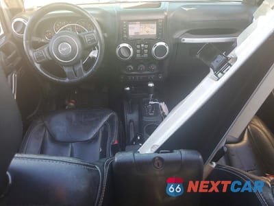 Zdjęcie 8 z 13 samochodu: 2013 JEEP WRANGLER UNLIMITED SAHARA VIN:1C4BJWEGXDL609924 - miniatura