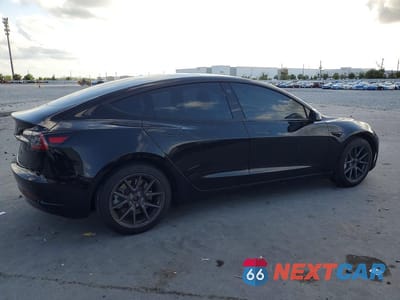 Trzecie zdjęcie samochodu z tyłu: 2023 TESLA MODEL 3 VIN:5YJ3E1EA5PF587037 - miniatura