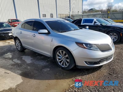 Czwarte zdjęcie samochodu z boku: 2014 LINCOLN MKS VIN:1LNHL9EK6EG605448 - miniatura