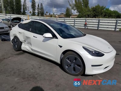 Czwarte zdjęcie samochodu z boku: 2022 TESLA MODEL 3 VIN:5YJ3E1EA8NF163400 - miniatura