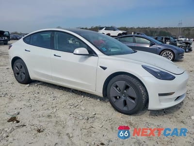 Czwarte zdjęcie samochodu z boku: 2023 TESLA MODEL 3 VIN:5YJ3E1EA2PF506785 - miniatura