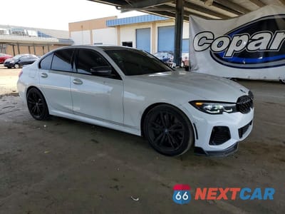 Czwarte zdjęcie samochodu z boku: 2022 BMW M340I VIN:3MW5U7J00N8C54948 - miniatura
