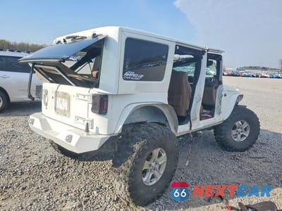 Trzecie zdjęcie samochodu z tyłu: 2012 JEEP WRANGLER UNLIMITED SAHARA VIN:1C4HJWEG5CL113762 - miniatura