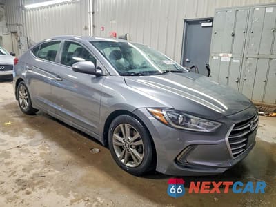 Czwarte zdjęcie samochodu z boku: 2018 HYUNDAI ELANTRA VALUE EDITION VIN:5NPD84LF0JH396078 - miniatura