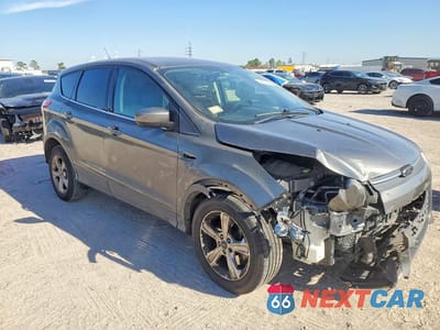 Czwarte zdjęcie samochodu z boku: 2014 FORD ESCAPE SE VIN:1FMCU9G99EUC30982 - miniatura