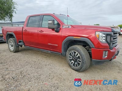 Czwarte zdjęcie samochodu z boku: 2022 GMC SIERRA K2500 AT4 VIN:1GT49PEY1NF219214 - miniatura
