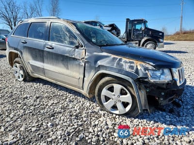 Czwarte zdjęcie samochodu z boku: 2011 JEEP GRAND CHEROKEE LAREDO VIN:1J4RR4GG2BC738613 - miniatura
