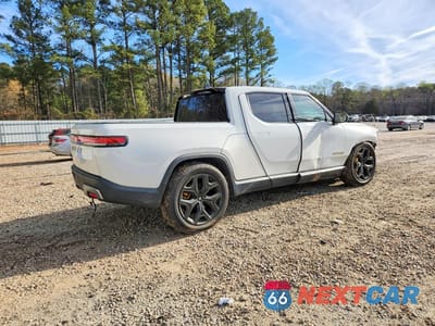 Trzecie zdjęcie samochodu z tyłu: 2022 RIVIAN R1T ADVENTURE VIN:7FCTGAAA2NN006568 - miniatura