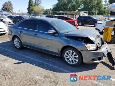 Czwarte zdjęcie samochodu z boku: 2014 VOLKSWAGEN JETTA VIN:3VWD17AJ7EM425232 - miniatura