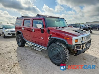 Czwarte zdjęcie samochodu z boku: 2004 HUMMER H2 VIN:5GRGN23U64H104704 - miniatura