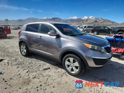 Czwarte zdjęcie samochodu z boku: 2012 KIA SPORTAGE LX VIN:KNDPB3A29C7248396 - miniatura