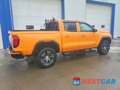 Trzecie zdjęcie samochodu z tyłu: 2025 GMC CANYON AT4 VIN:1GTP2DEK3S1220210 - miniatura