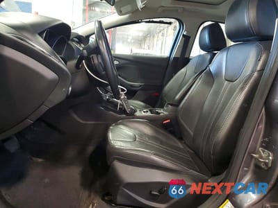 Zdjęcie 7 z 11 samochodu: 2013 FORD FOCUS TITANIUM VIN:1FADP3N23DL277115 - miniatura