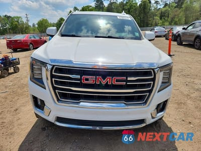 Piąte zdjęcie samochodu w środku: 2021 GMC YUKON SLT VIN:1GKS2BKD3MR117379 - miniatura