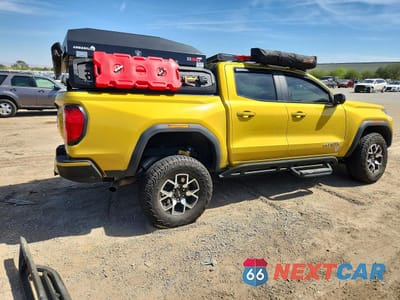 Trzecie zdjęcie samochodu z tyłu: 2023 GMC CANYON AT4X VIN:1GTP6EEK9P1265475 - miniatura