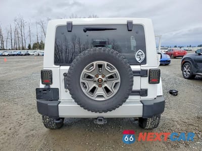 Zdjęcie 6 z 13 samochodu: 2013 JEEP WRANGLER UNLIMITED SAHARA VIN:1C4BJWEG8DL695038 - miniatura