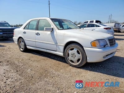 Czwarte zdjęcie samochodu z boku: 1999 MERCEDES-BENZ C 43 VIN:WDBHA33G0XF850856 - miniatura
