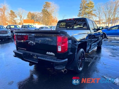 Trzecie zdjęcie samochodu z tyłu: 2016 CHEVROLET SILVERADO K1500 HIGH COUNTRY VIN:3GCUKTEJ5GG201056 - miniatura