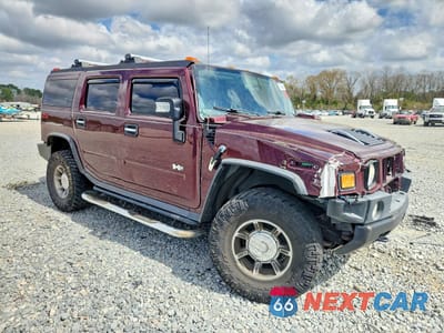 Czwarte zdjęcie samochodu z boku: 2006 HUMMER H2 VIN:5GRGN23U06H117953 - miniatura