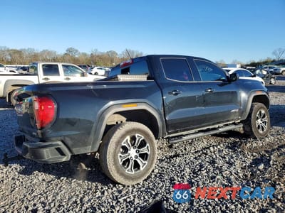 Trzecie zdjęcie samochodu z tyłu: 2024 GMC CANYON AT4 VIN:1GTP6DEKXR1192968 - miniatura
