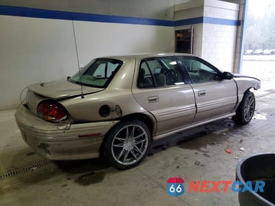 Trzecie zdjęcie samochodu z tyłu: 1998 PONTIAC GRAND AM SE VIN:1G2NE52T9WM500188 - miniatura