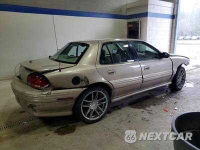 Trzecie zdjęcie samochodu z tyłu: 1998 PONTIAC GRAND AM SE VIN:1G2NE52T9WM500188 - miniatura