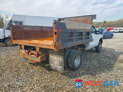 Czwarte zdjęcie samochodu z boku: 2011 FORD F350 SUPER DUTY DUMP TRUCK VIN:1FDRF3H65BEC77292 - miniatura