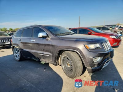 Czwarte zdjęcie samochodu z boku: 2014 JEEP GRAND CHEROKEE OVERLAND VIN:1C4RJFCM2EC423741 - miniatura