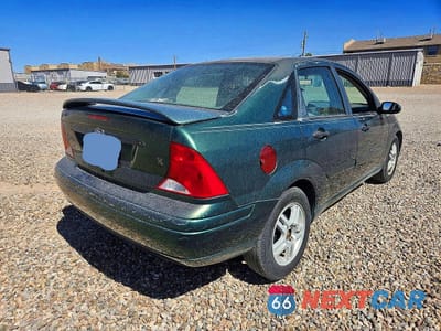 Czwarte zdjęcie samochodu z boku: 2000 FORD FOCUS SE VIN:1FAFP3433YW219500 - miniatura