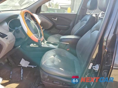 Zdjęcie 7 z 12 samochodu: 2013 HYUNDAI TUCSON LIMITED VIN:KM8JUCAC0DU622580 - miniatura