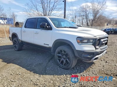 Czwarte zdjęcie samochodu z boku: 2020 RAM 1500 4WD V8 CREW CAB 5.7L REBEL VIN:1C6SRFLT2LN279344 - miniatura