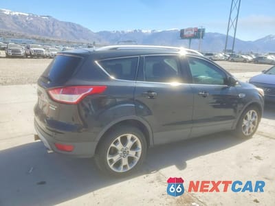 Trzecie zdjęcie samochodu z tyłu: 2014 FORD ESCAPE TITANIUM VIN:1FMCU0J92EUE06887 - miniatura