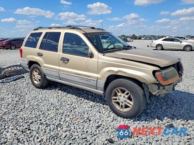 Czwarte zdjęcie samochodu z boku: 2000 JEEP GRAND CHEROKEE LAREDO VIN:1J4G248S0YC145131 - miniatura