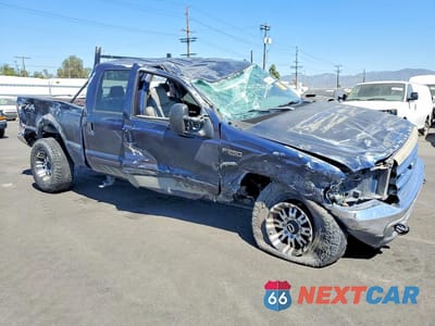 Czwarte zdjęcie samochodu z boku: 2002 FORD F250 SUPER DUTY VIN:1FTNW21S22EB64291 - miniatura