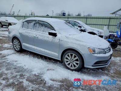Czwarte zdjęcie samochodu z boku: 2015 VOLKSWAGEN JETTA BASE VIN:3VW1K7AJ4FM412603 - miniatura