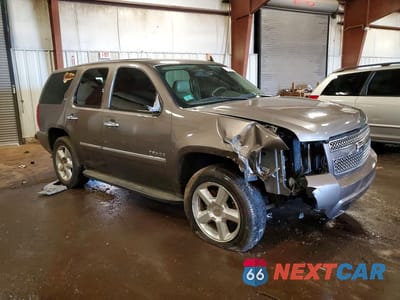 Czwarte zdjęcie samochodu z boku: 2011 CHEVROLET TAHOE K1500 LTZ VIN:1GNSKCE00BR236196 - miniatura