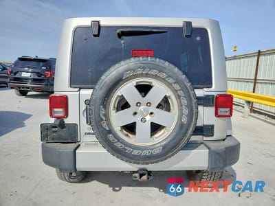 Zdjęcie 6 z 12 samochodu: 2012 JEEP WRANGLER UNLIMITED SAHARA VIN:1C4BJWEG6CL188752 - miniatura