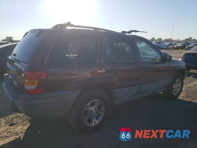 Trzecie zdjęcie samochodu z tyłu: 1999 JEEP GRAND CHEROKEE LAREDO VIN:1J4GW58S6XC784073 - miniatura