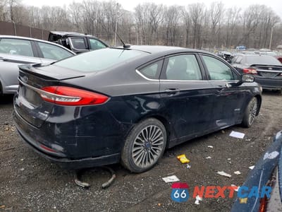 Trzecie zdjęcie samochodu z tyłu: 2018 FORD FUSION SE HYBRID VIN:3FA6P0LU0JR137628 - miniatura